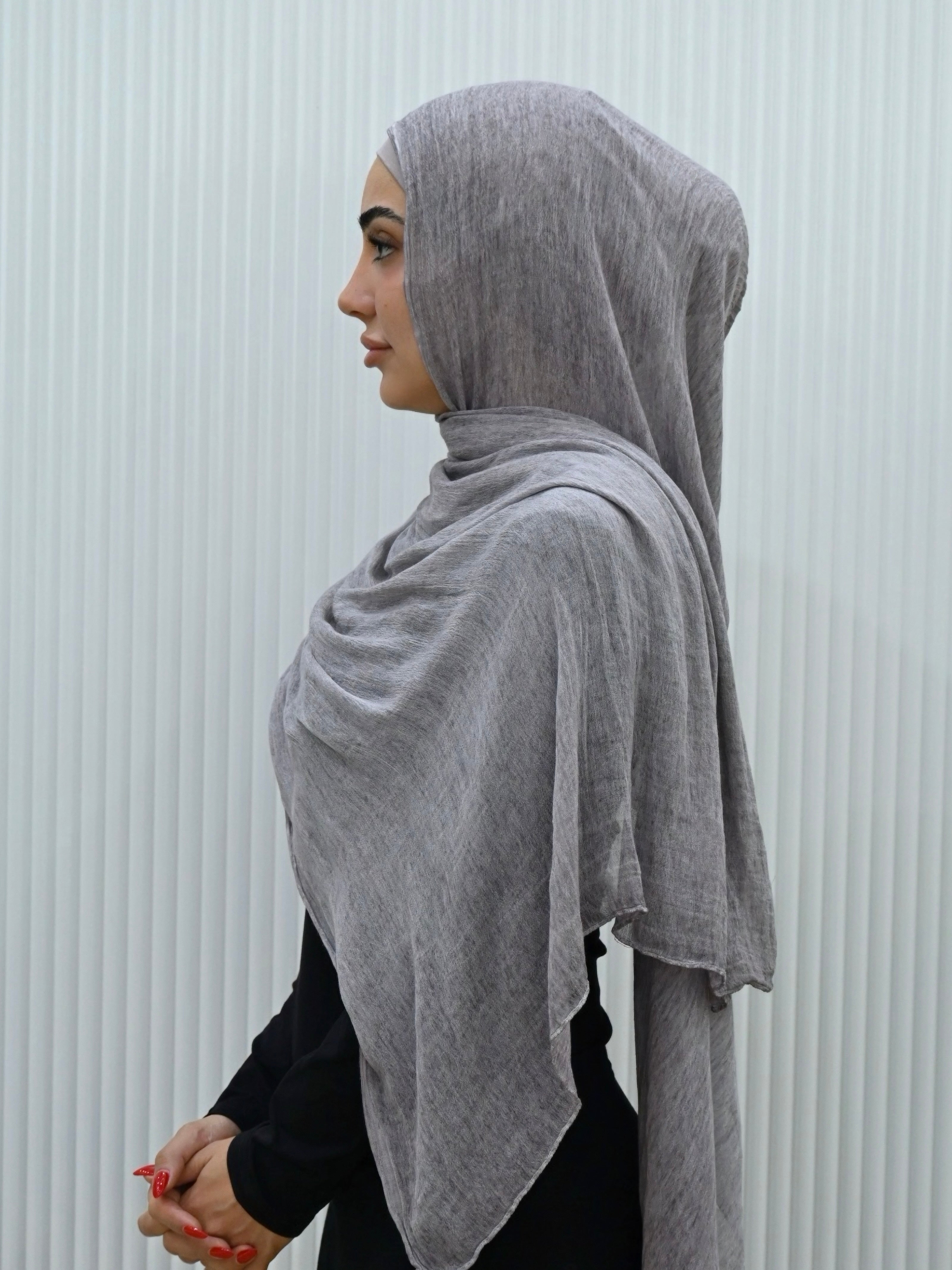 Crafted from soft rayon, this textured hijab drapes effortlessly while offering a breathable and lightweight feel. 