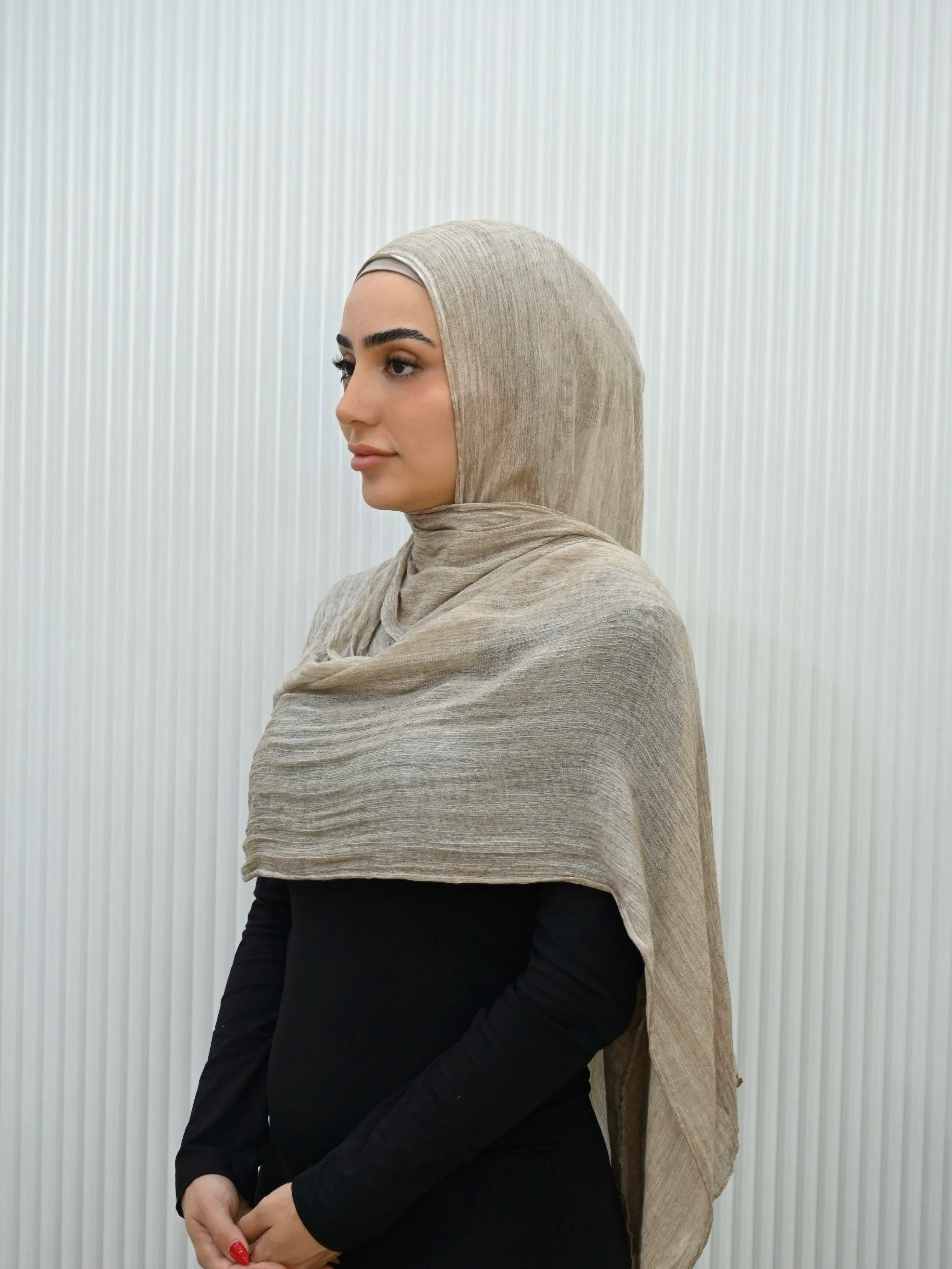 Crafted from soft rayon, this textured hijab drapes effortlessly while offering a breathable and lightweight feel. 