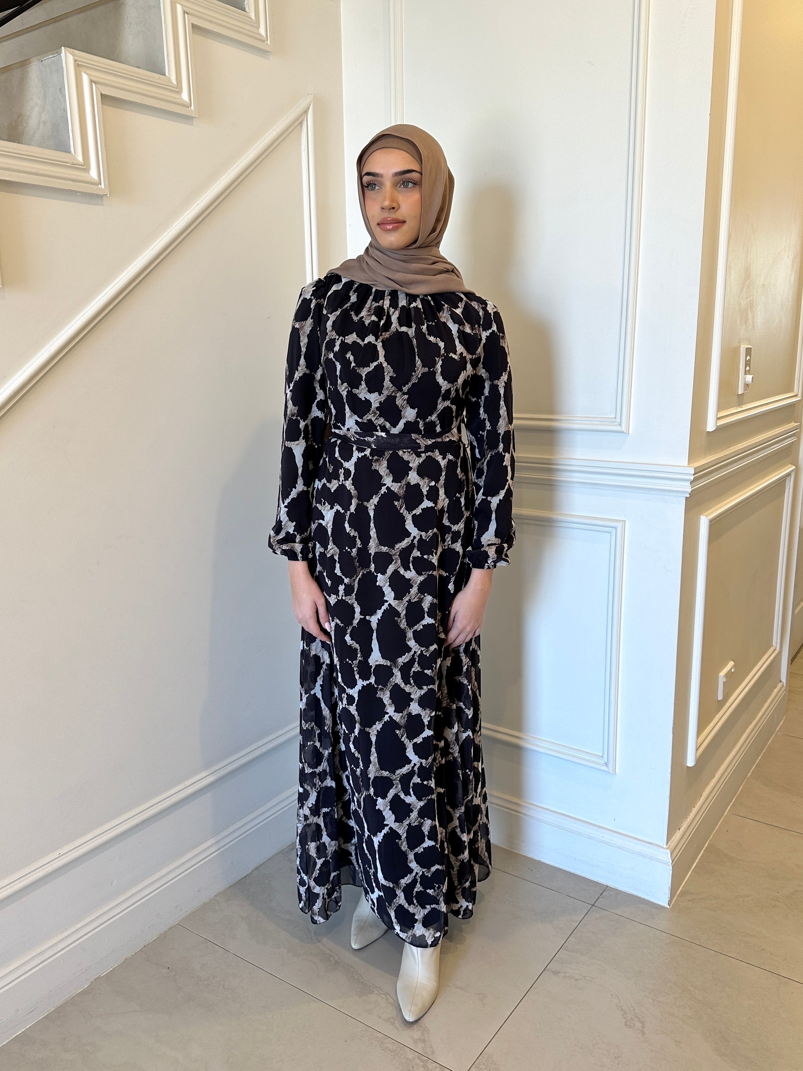 woman wearing printed chiffon maxi dress 