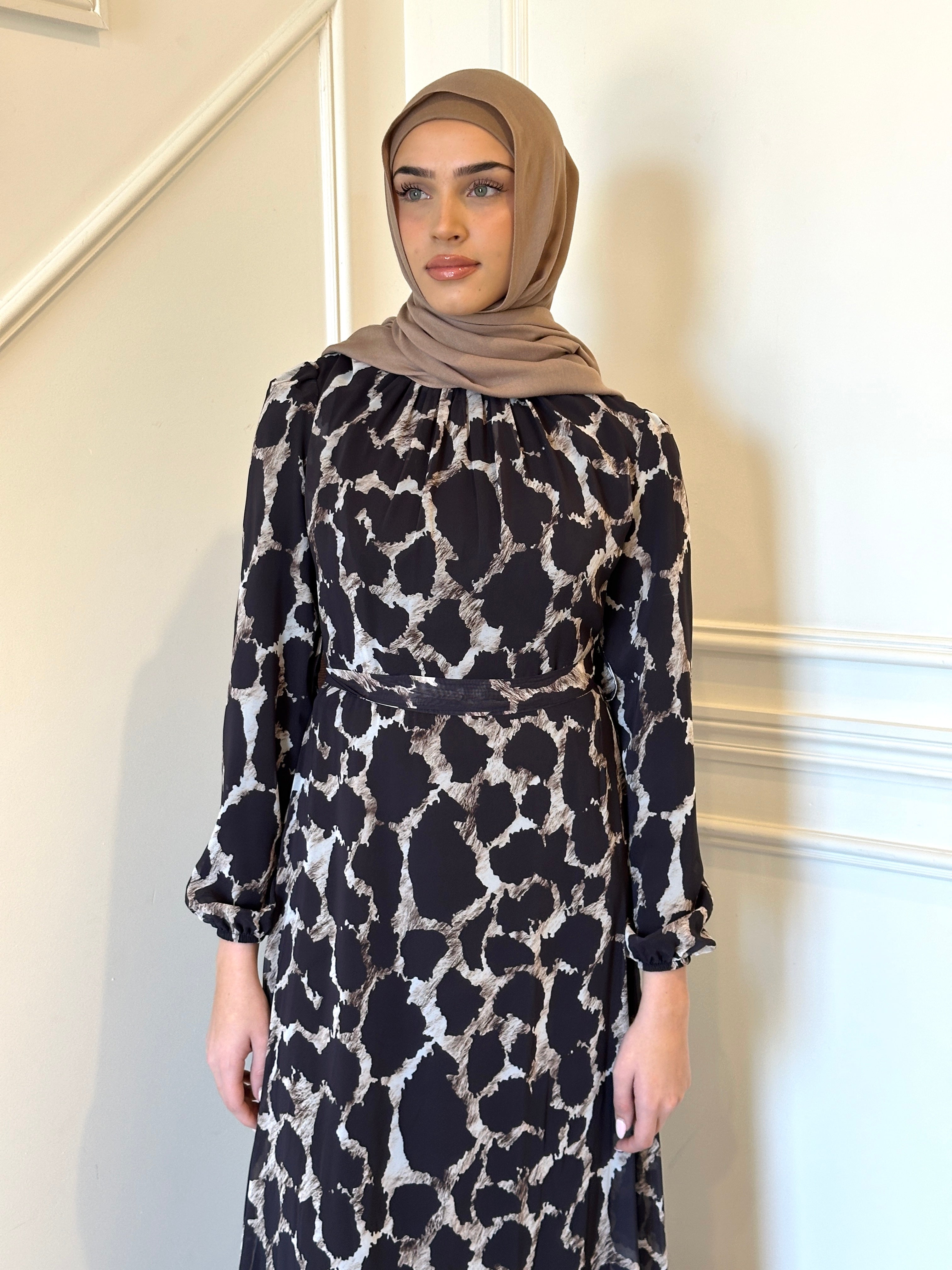 woman wearing printed chiffon maxi dress 