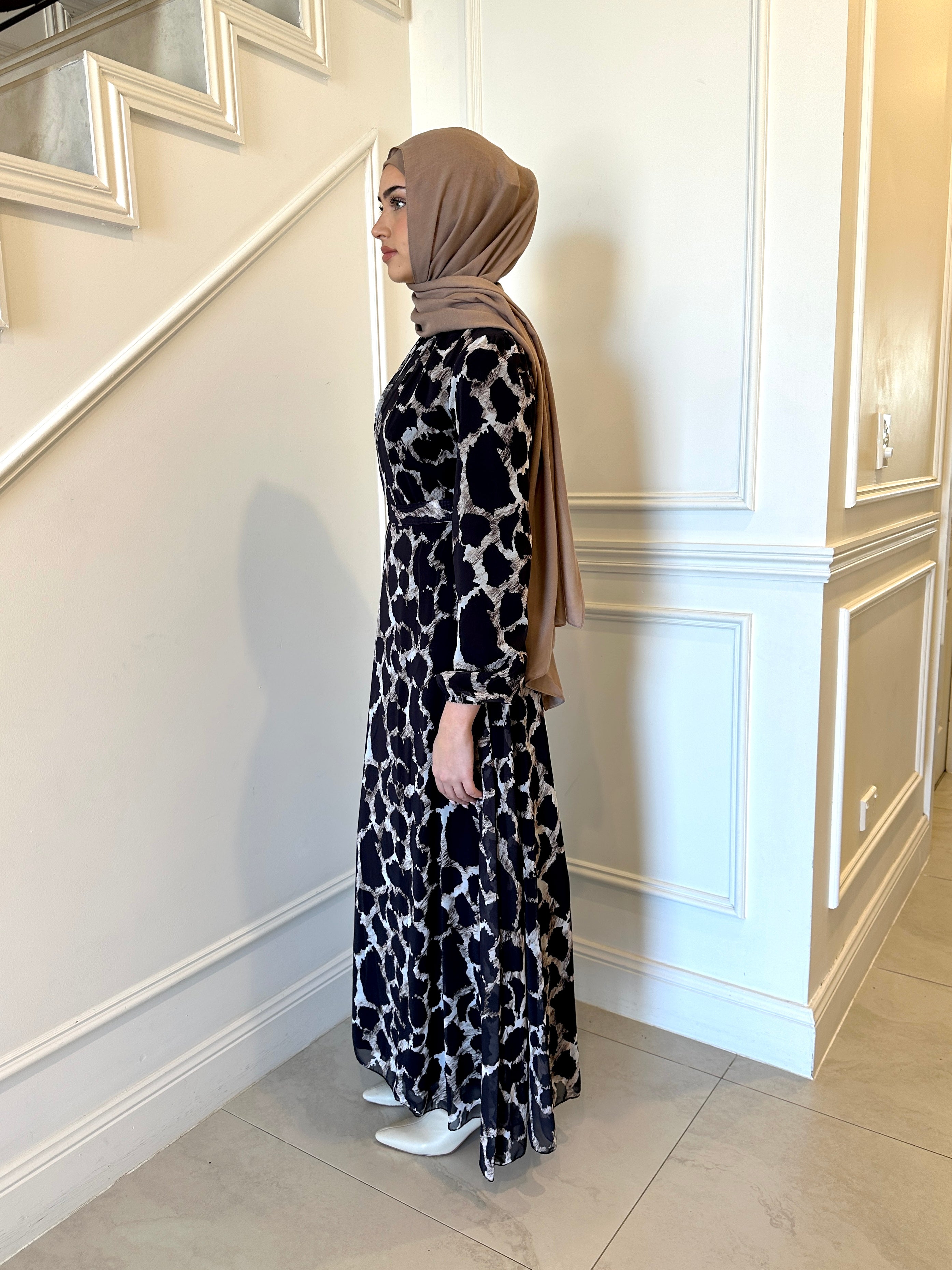 woman wearing printed chiffon maxi dress 