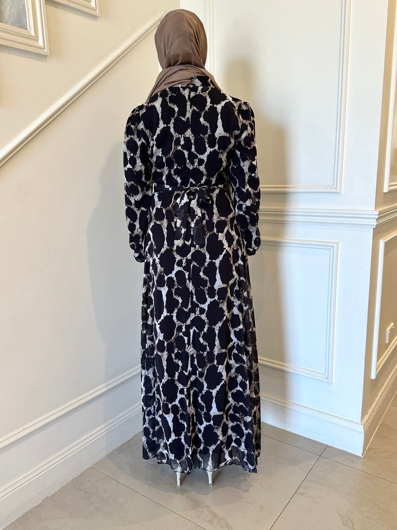 woman wearing printed chiffon maxi dress 