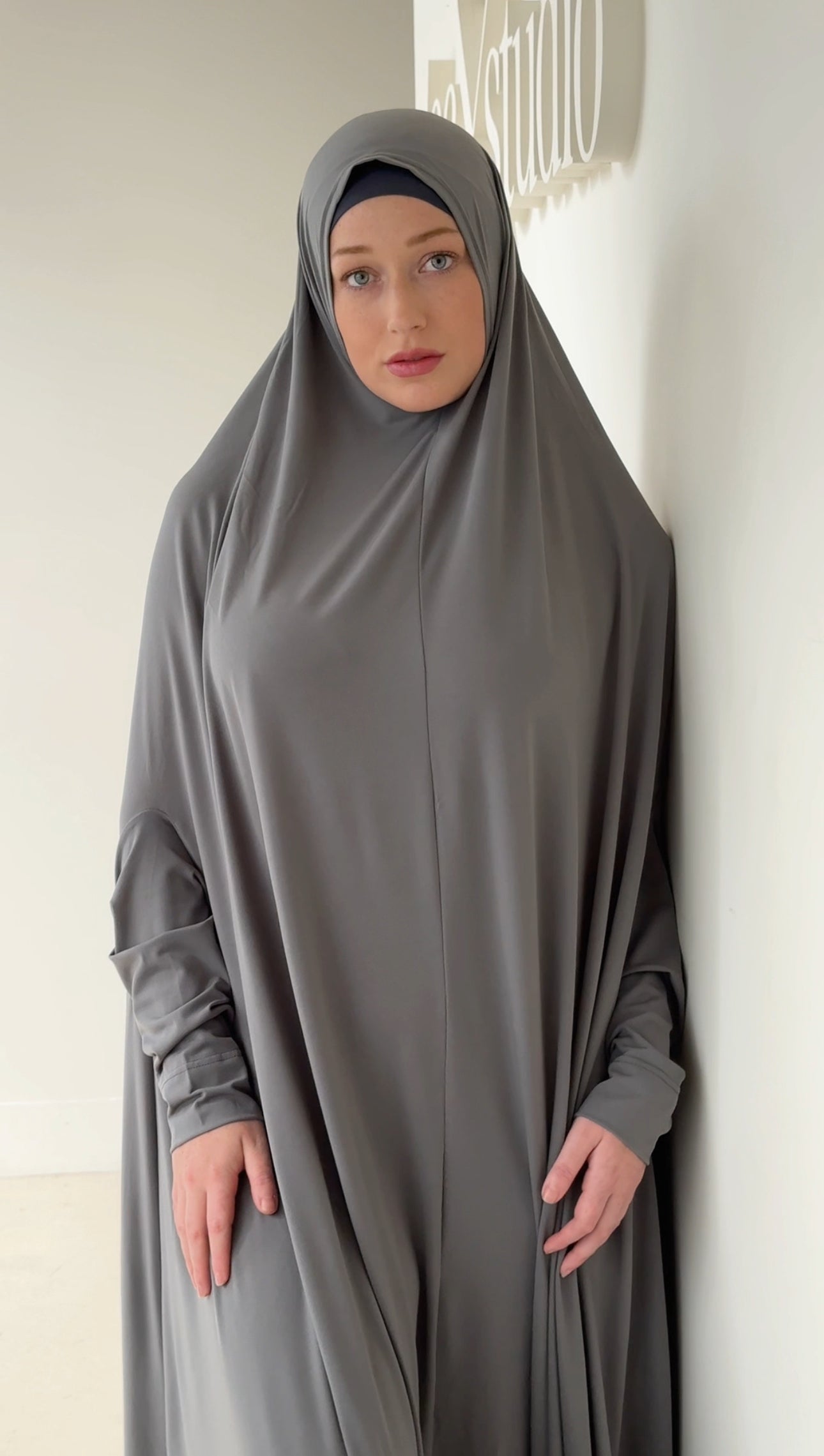 Model wearing a floor-length jilbab with a loose, flowing silhouette, styled for comfortable and modest everyday wear.