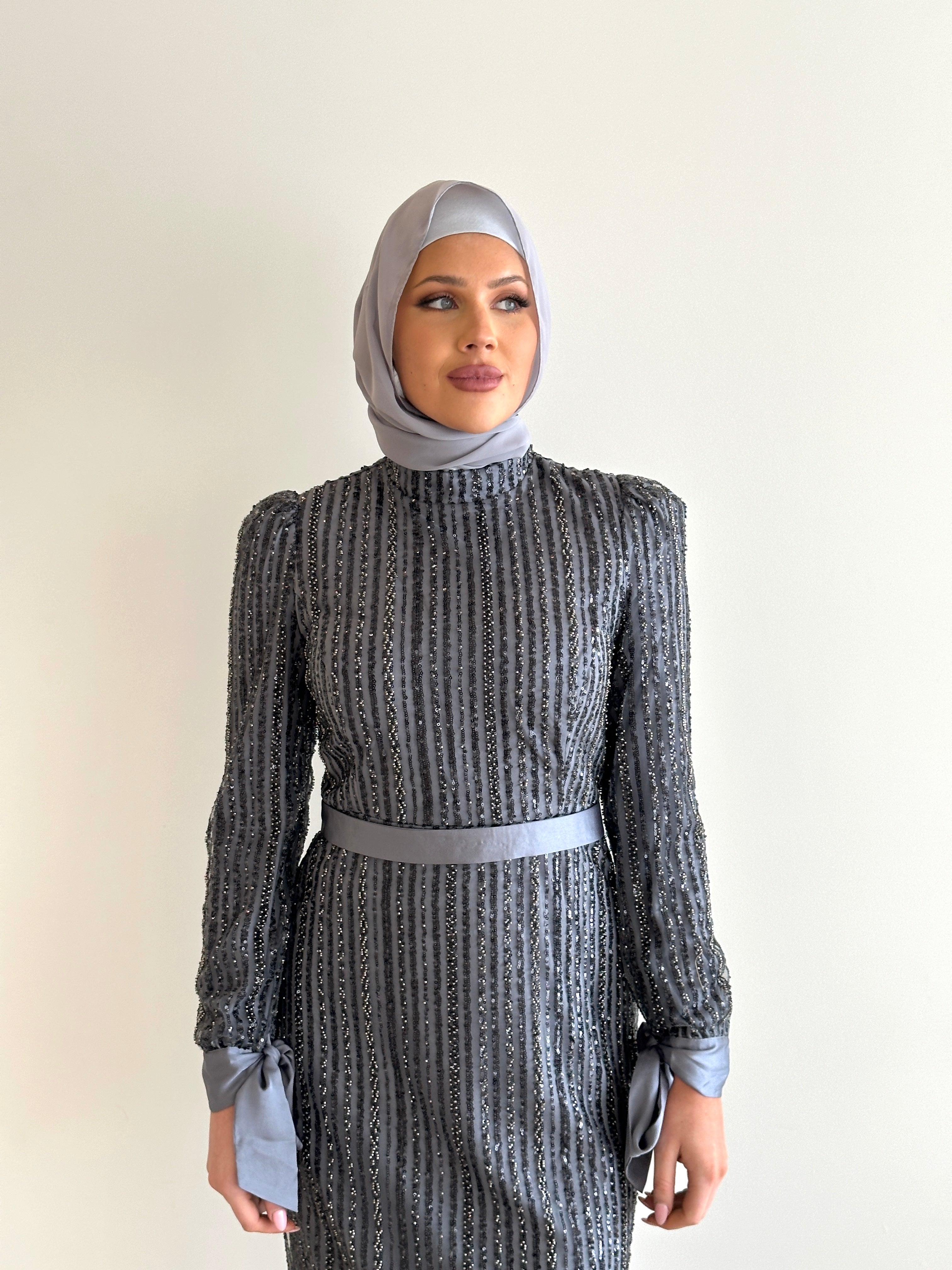 women wearing modest embellished formal dress, maxi, long sleeve with hijab in grey