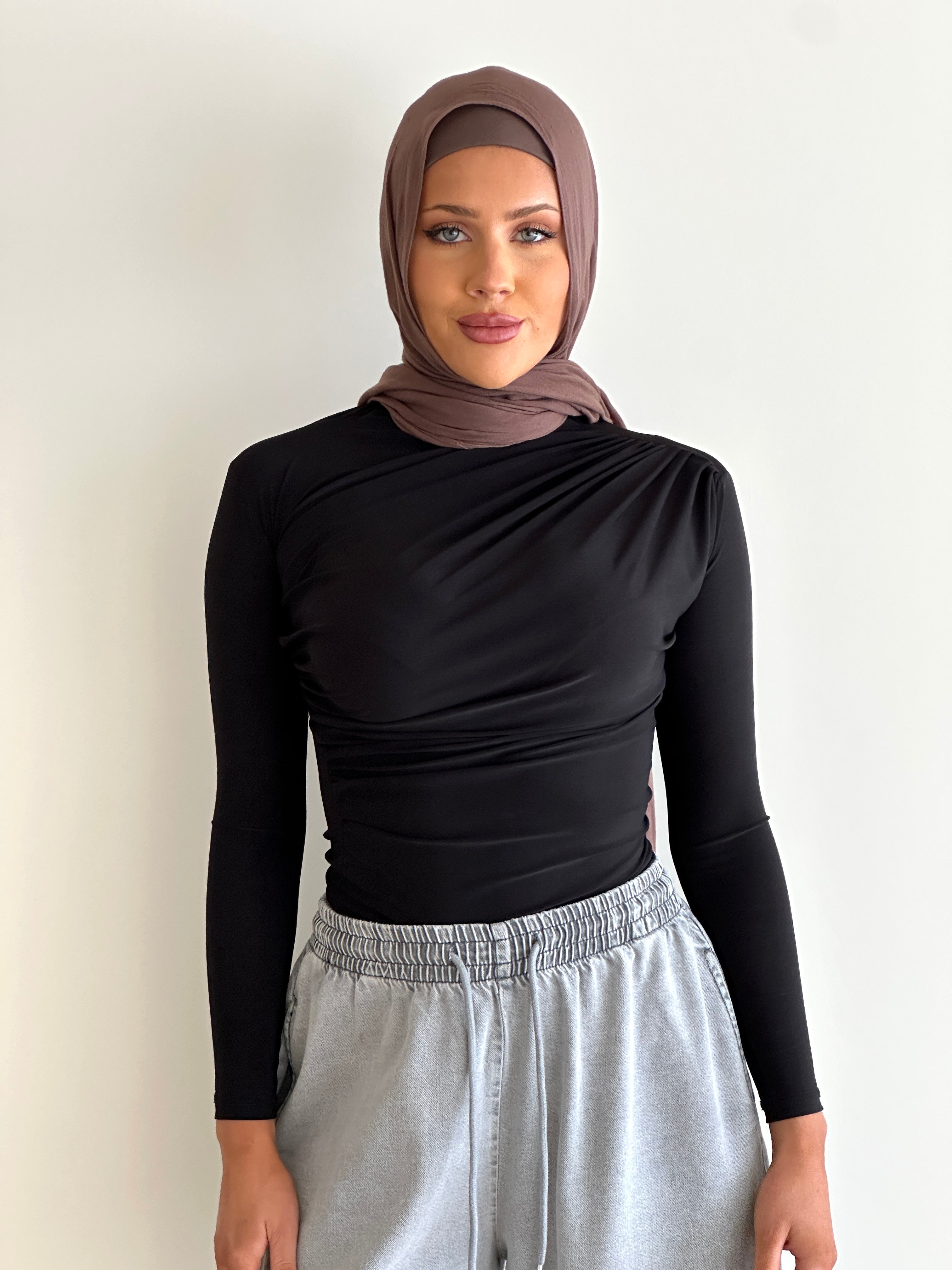 women's long sleeve body top, essential for layering with draping detail