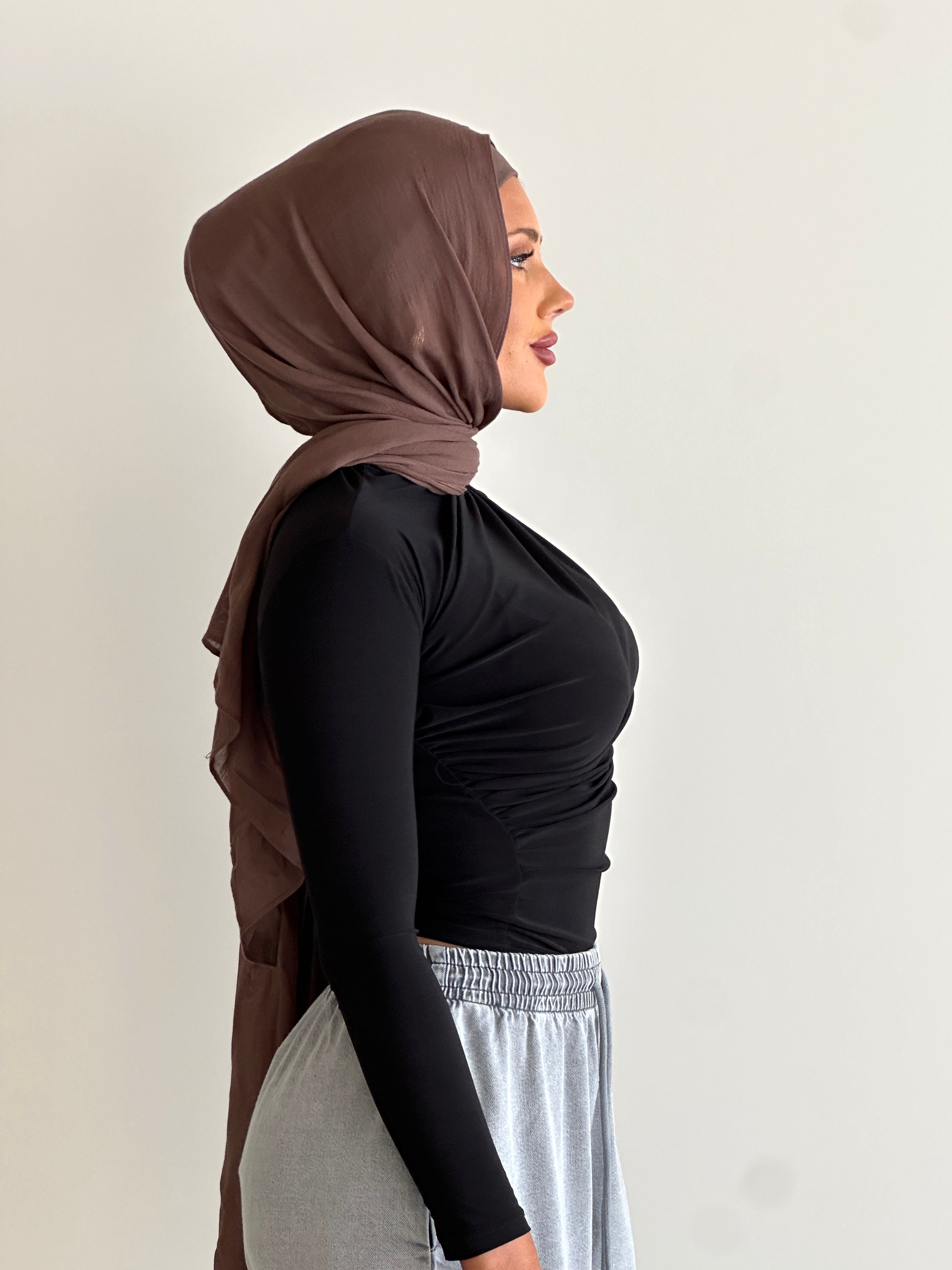 women's long sleeve body top, essential for layering with draping detail