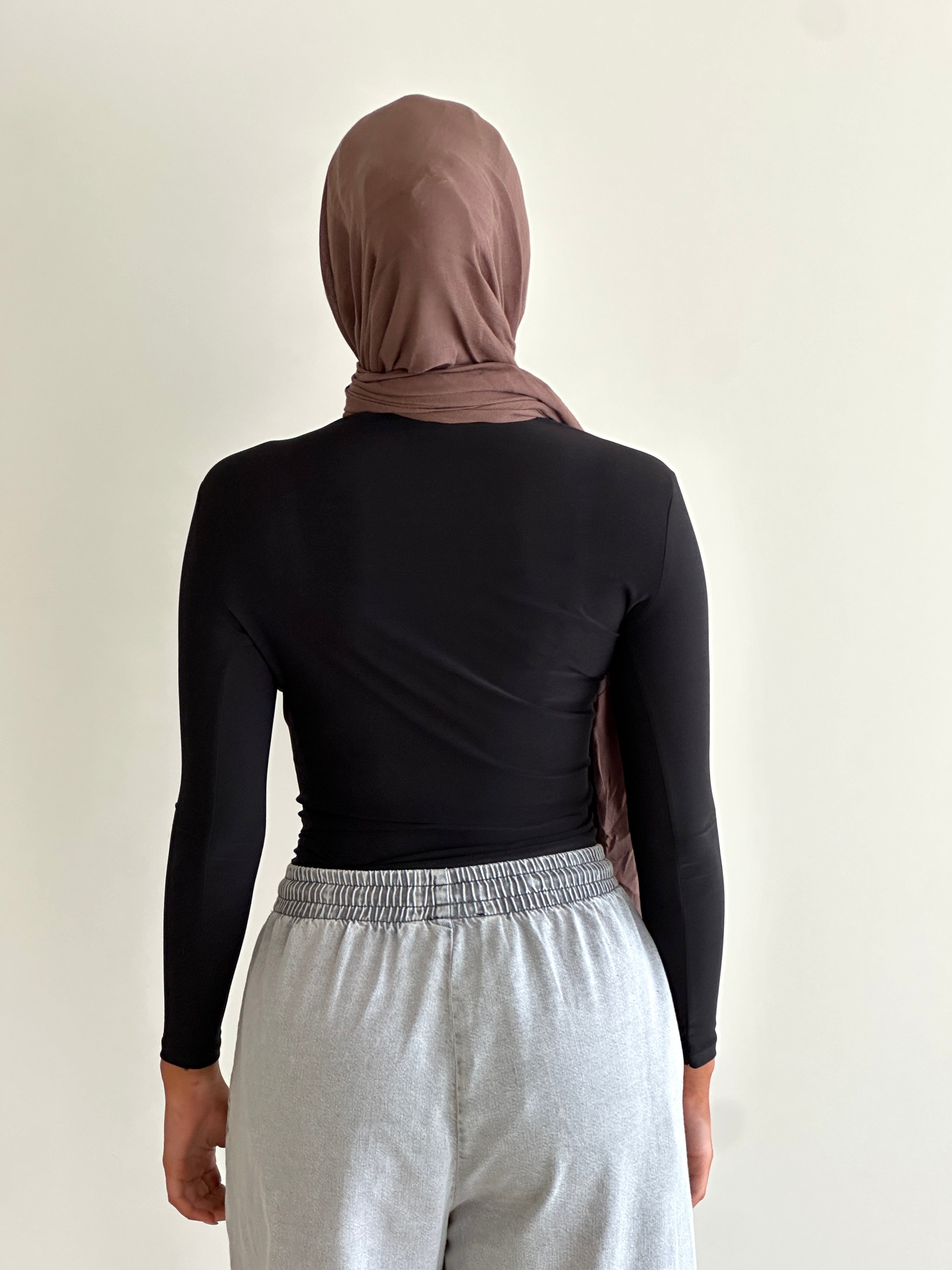 women's long sleeve body top, essential for layering with draping detail