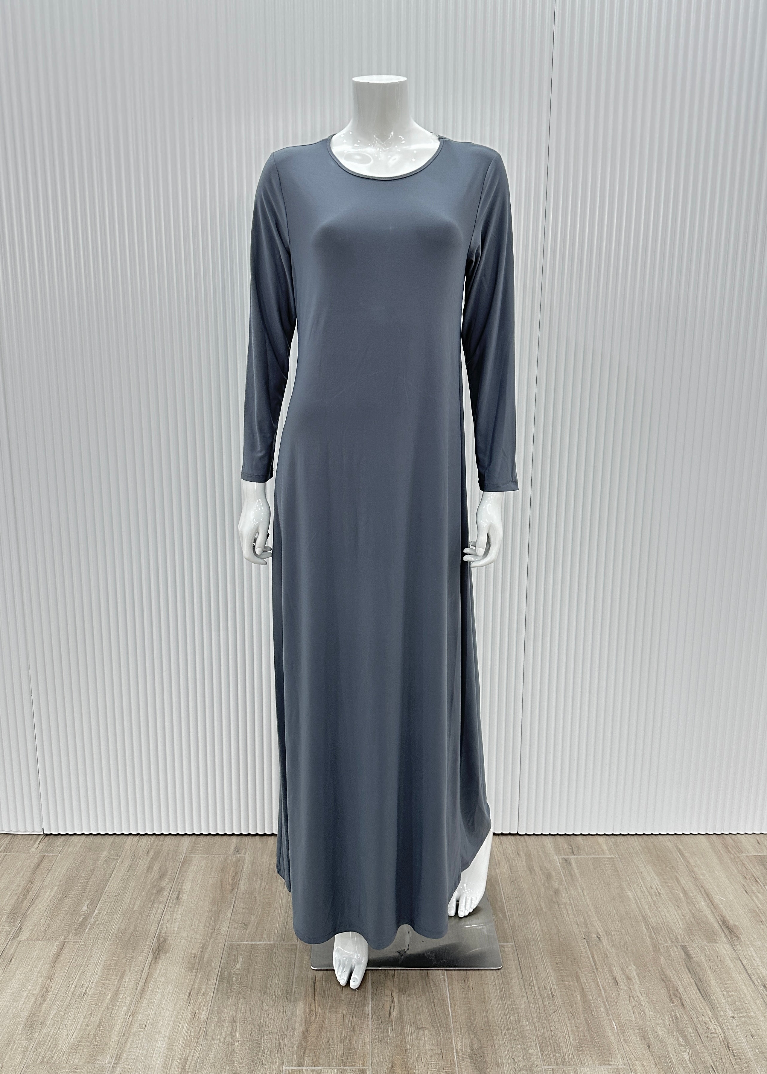 Model wearing the Staple Lycra dress featuring a smooth, streamlined silhouette in stretch lycra fabric, styled for everyday modest wear.