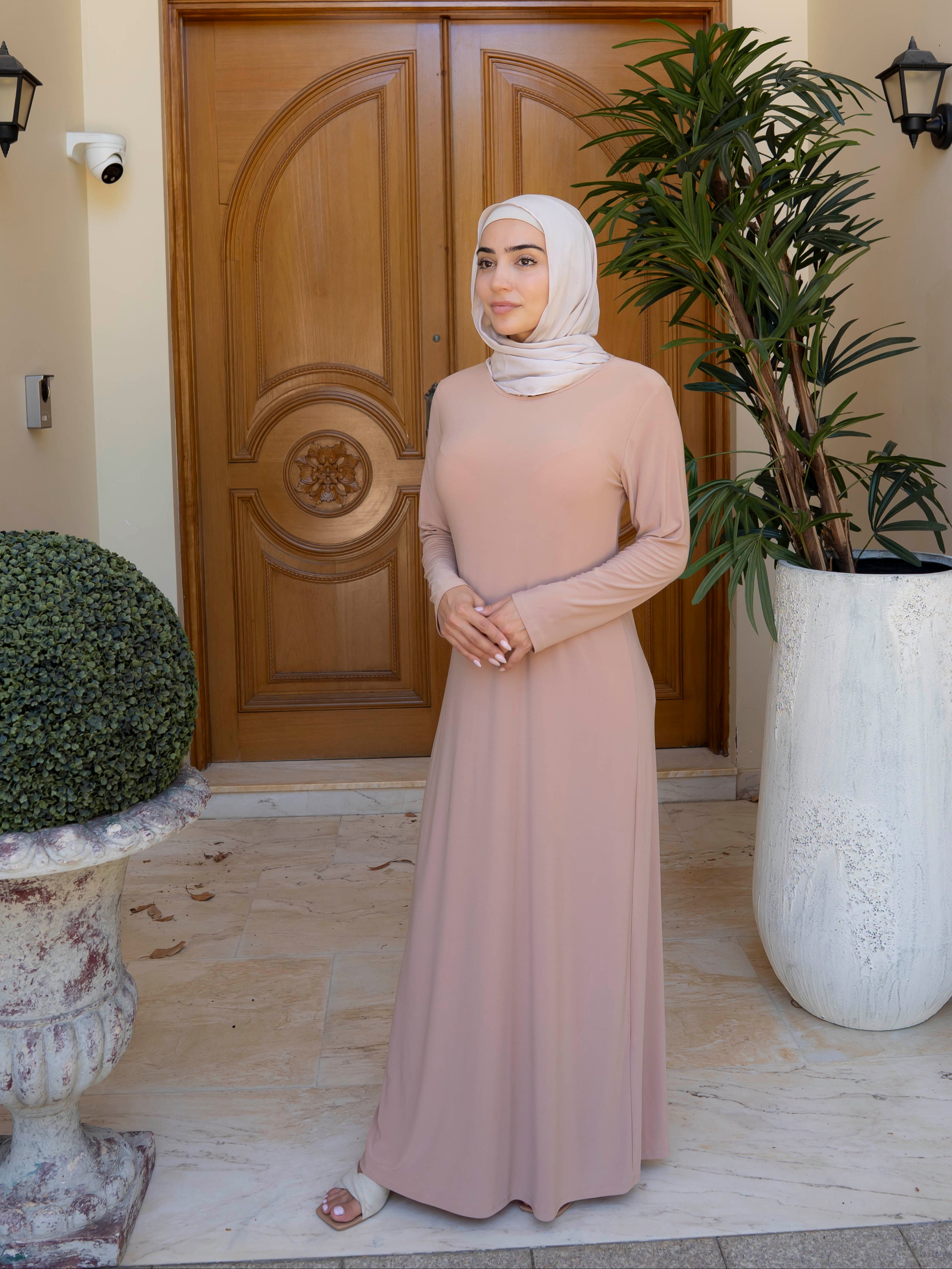 Model wearing the Staple Lycra dress featuring a smooth, streamlined silhouette in stretch lycra fabric, styled for everyday modest wear.