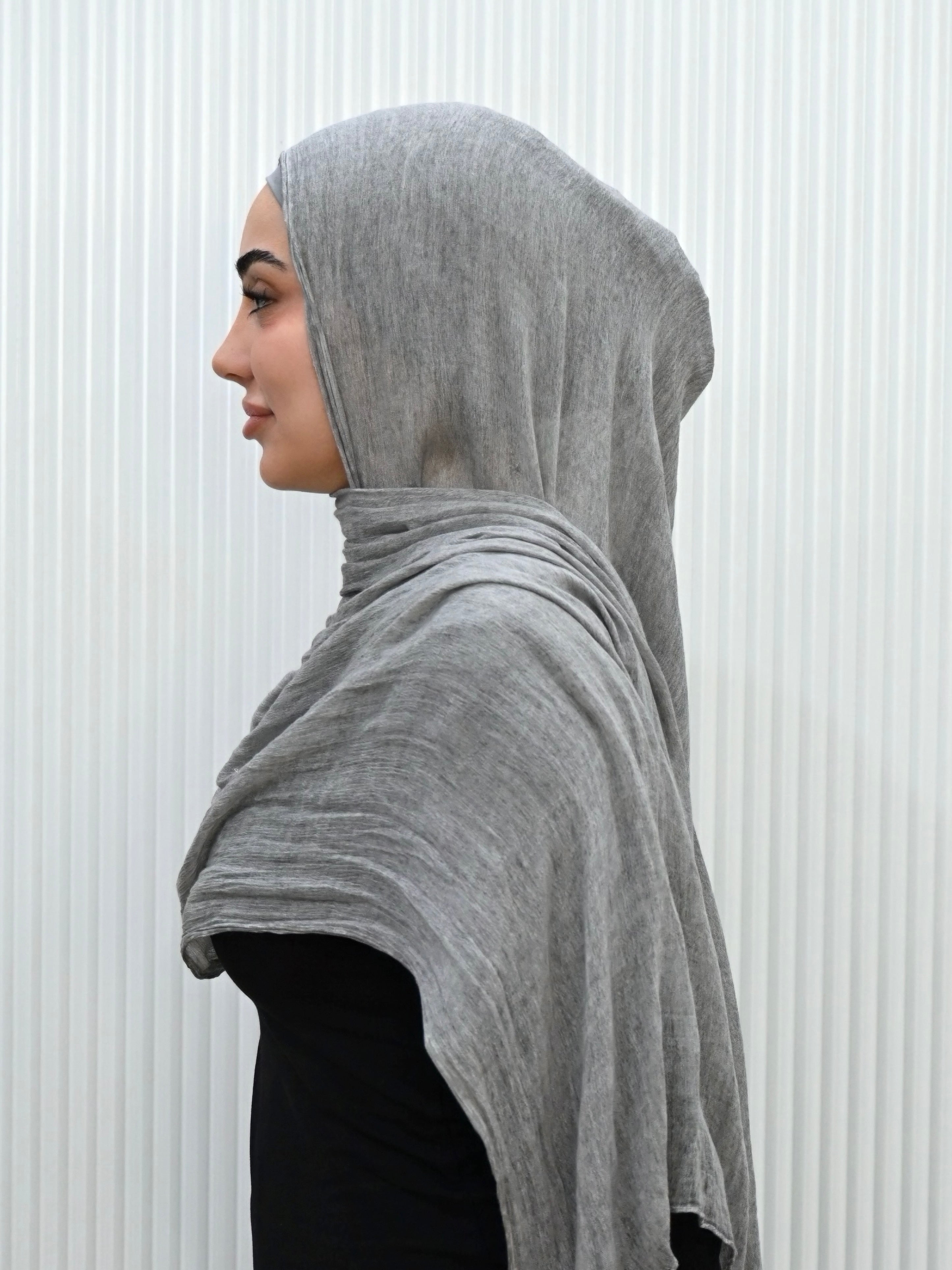Crafted from soft rayon, this textured hijab drapes effortlessly while offering a breathable and lightweight feel. Its subtle texture adds depth and dimension, perfect for everyday wear.