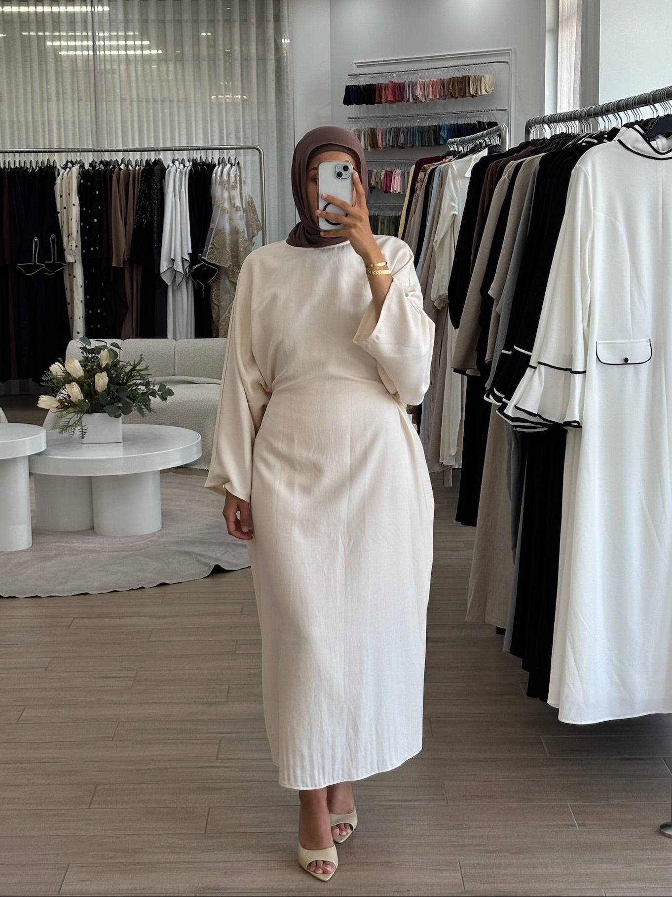 Woman wearing a long wrap two-way dress, featuring an adjustable wrap design and flowing modest silhouette.