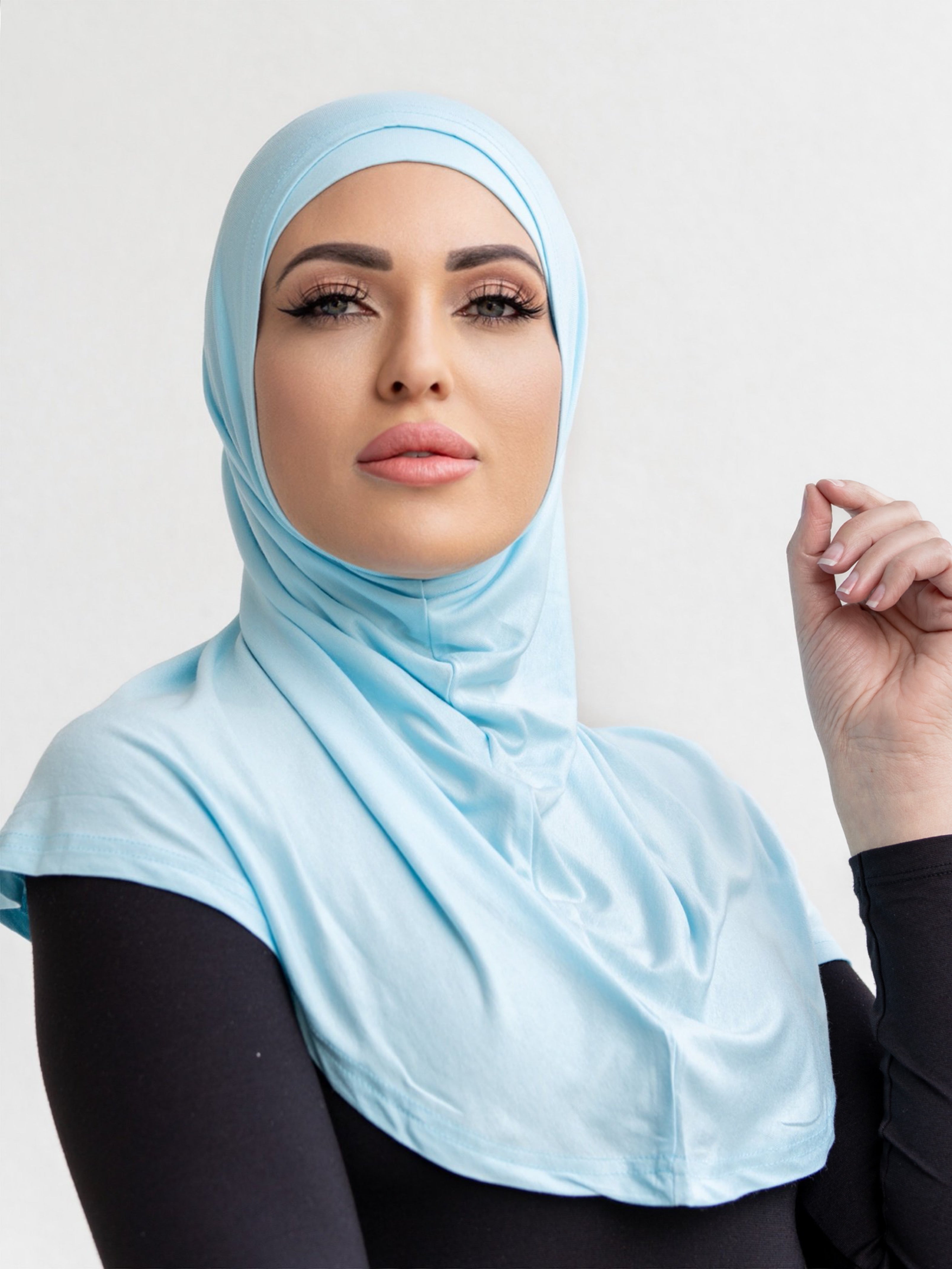 Our signature 2 piece scarf is made from a soft and stretchy, breathable cotton. It features a cap and overlay scarf that covers the head, neckline and skims over the shoulders. Wear it with your basics for an easy look.&nbsp;