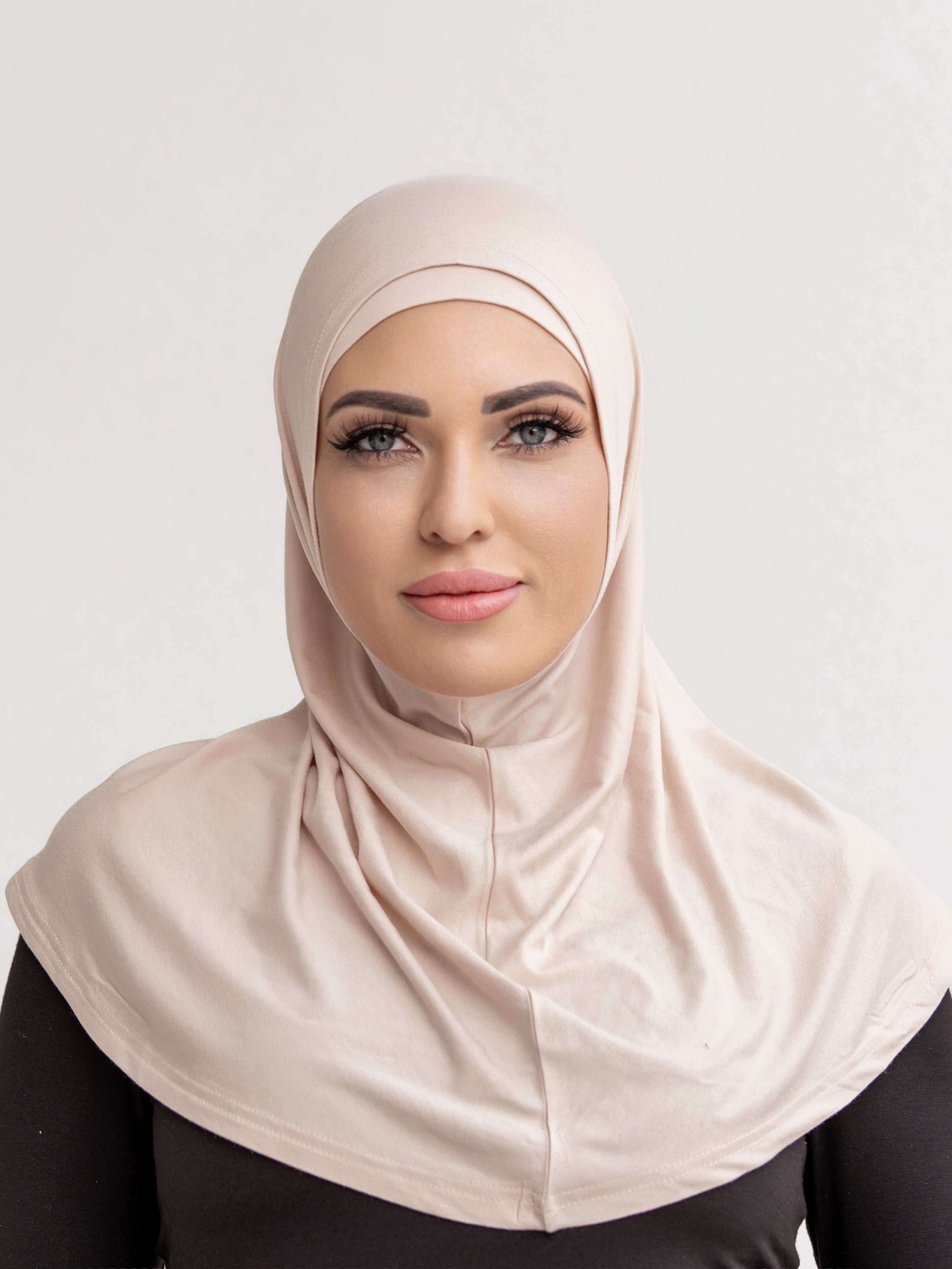 Our signature 2 piece scarf is made from a soft and stretchy, breathable cotton. It features a cap and overlay scarf that covers the head, neckline and skims over the shoulders. Wear it with your basics for an easy look.&nbsp;