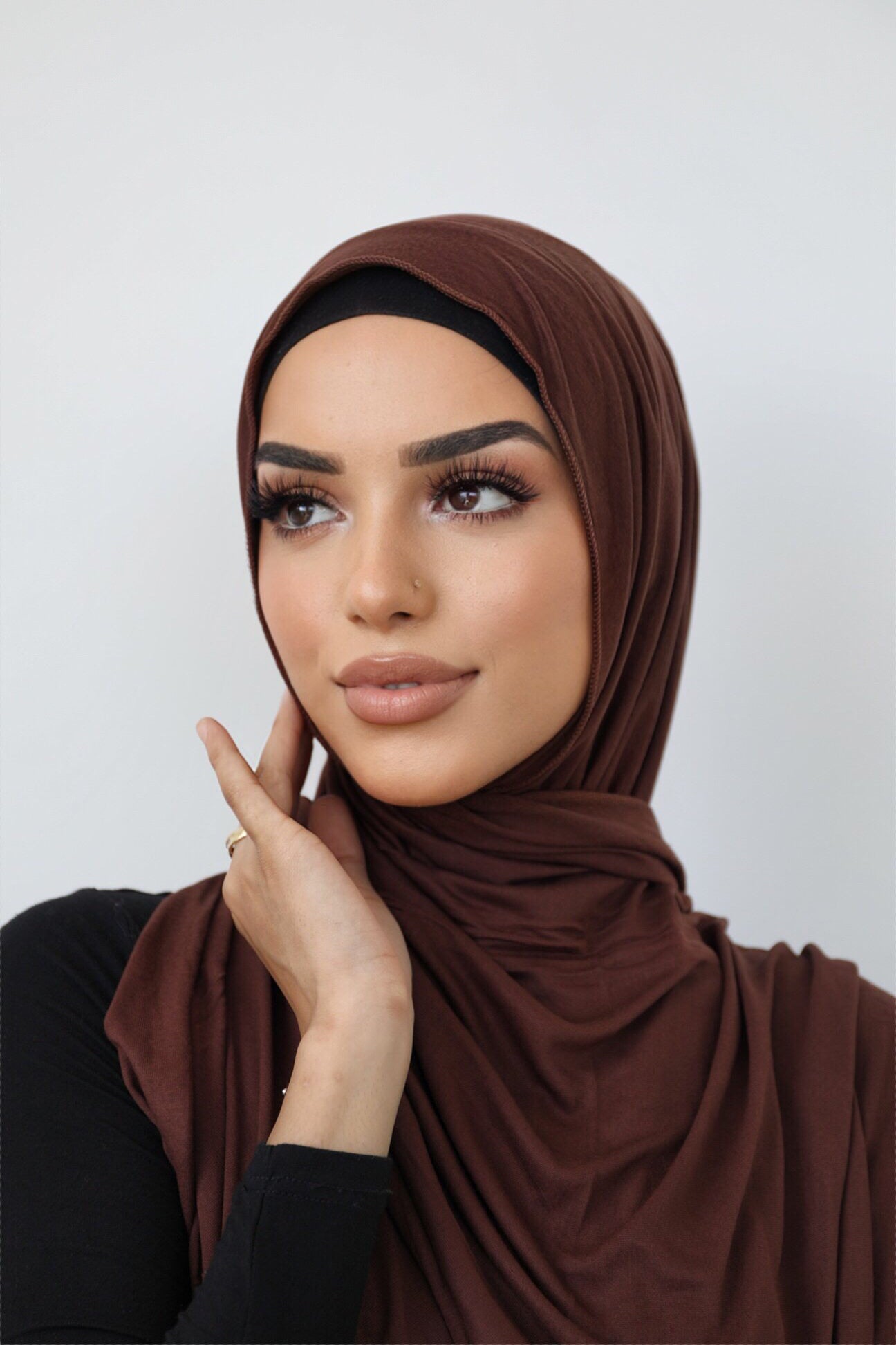 Signature jersey scarf made from soft, stretchy cotton with an extended length for easy wrapping and a secure, comfortable fit around the head.