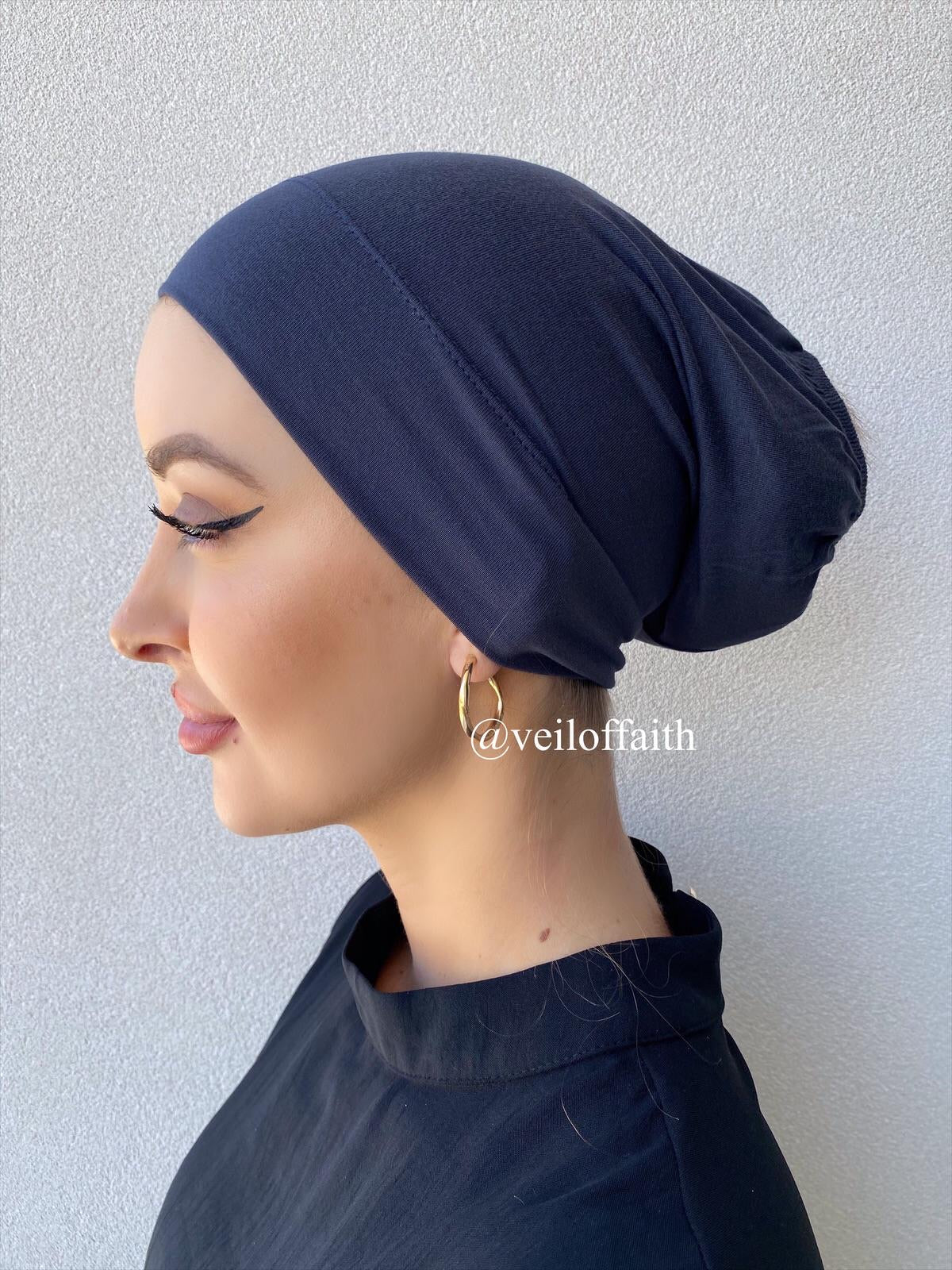 Bamboo under-scarf cap designed to cover hair beneath a hijab, made from soft, breathable natural bamboo fibers with cotton spandex stretch for comfort. Partially closed at the back with an elastic edge to comfortably accommodate hair.