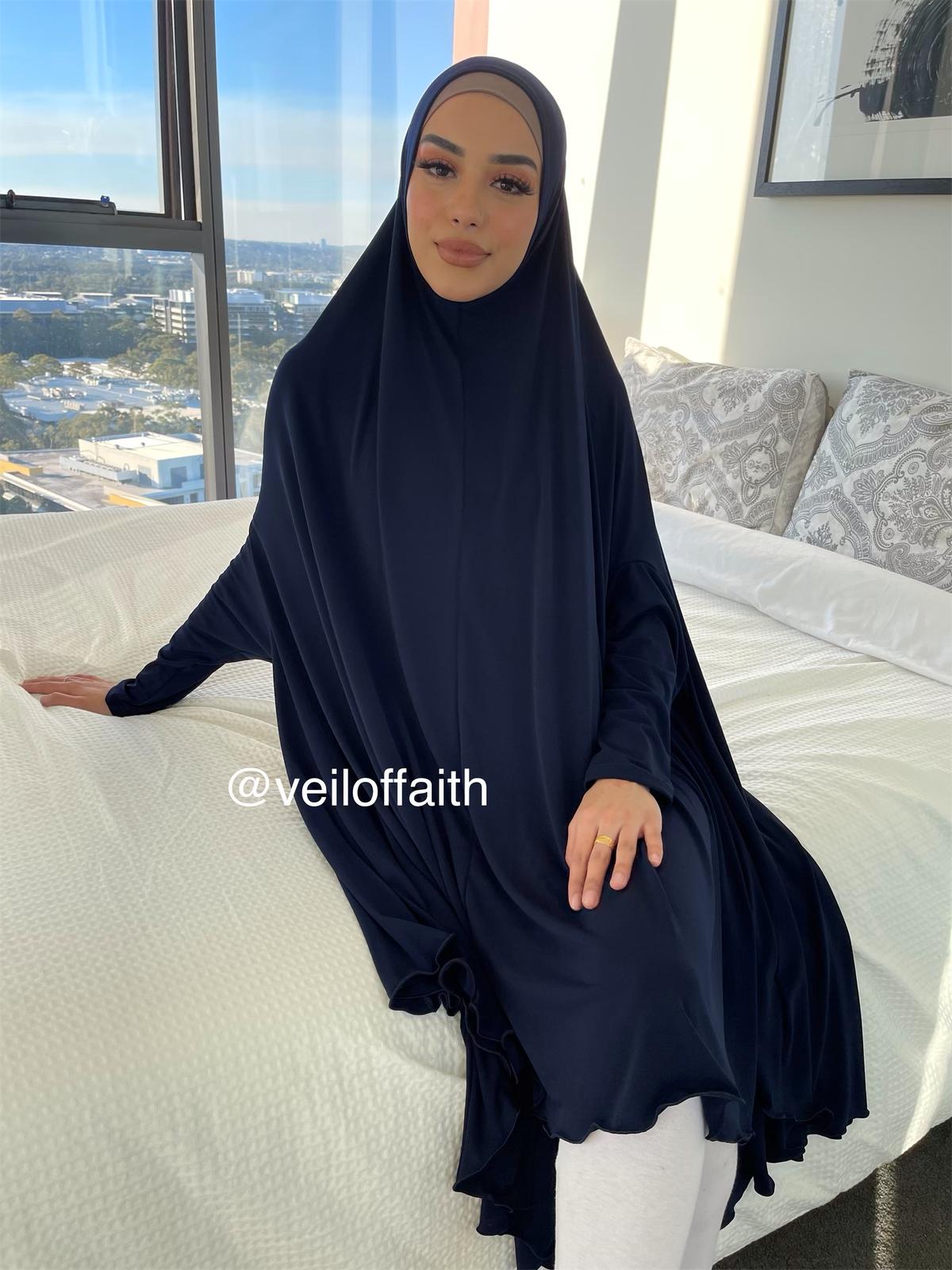 Long Jilbab drapes over the body and covers the knee for added modesty over a basic outfit. Features long sleeves to elimate the stress of finding a thin top to layer underneath.&nbsp;