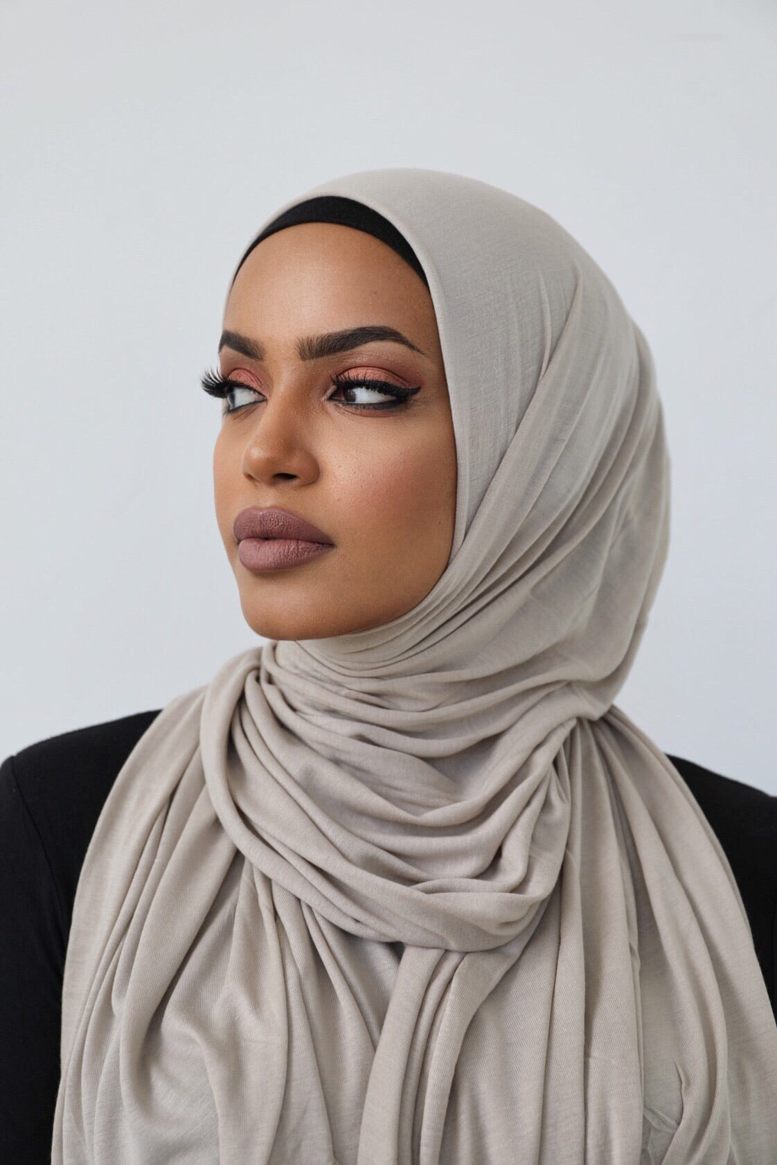 Signature jersey scarf made from soft, stretchy cotton with an extended length for easy wrapping and a secure, comfortable fit around the head.