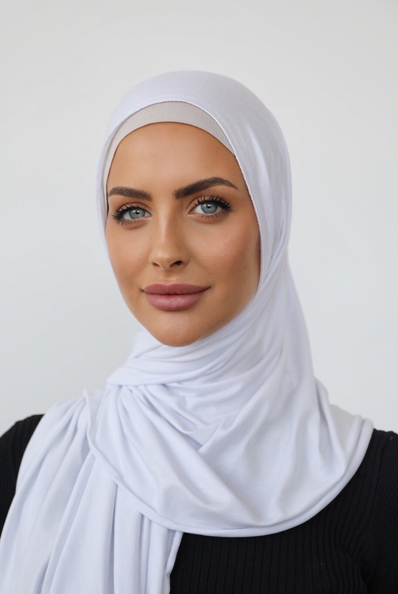 Signature jersey scarf made from soft, stretchy cotton with an extended length for easy wrapping and a secure, comfortable fit around the head.