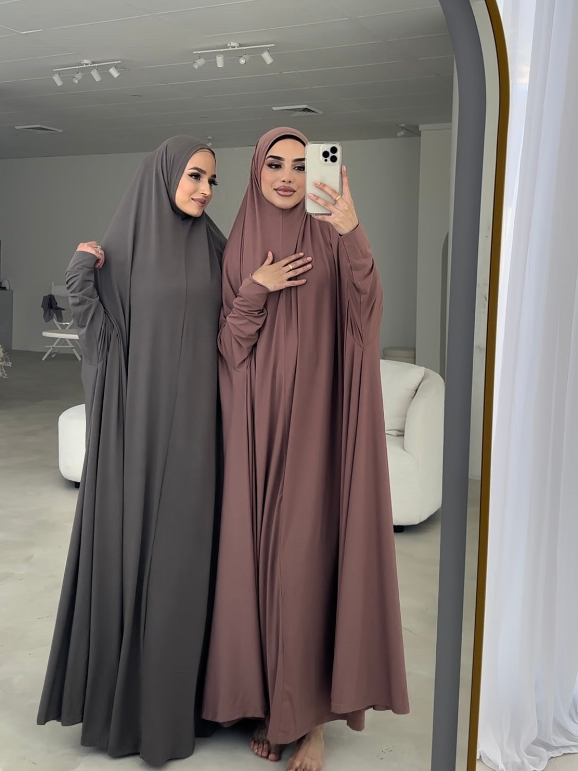 Model wearing a floor-length jilbab with a loose, flowing silhouette, styled for comfortable and modest everyday wear.