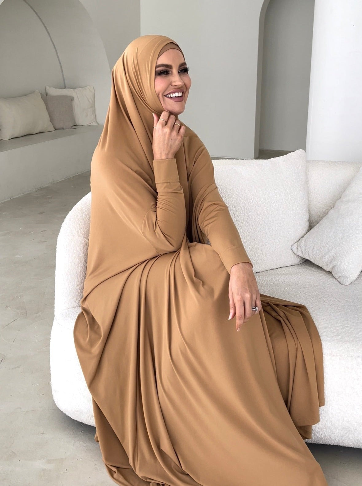 Model wearing a floor-length jilbab with a loose, flowing silhouette, styled for comfortable and modest everyday wear.